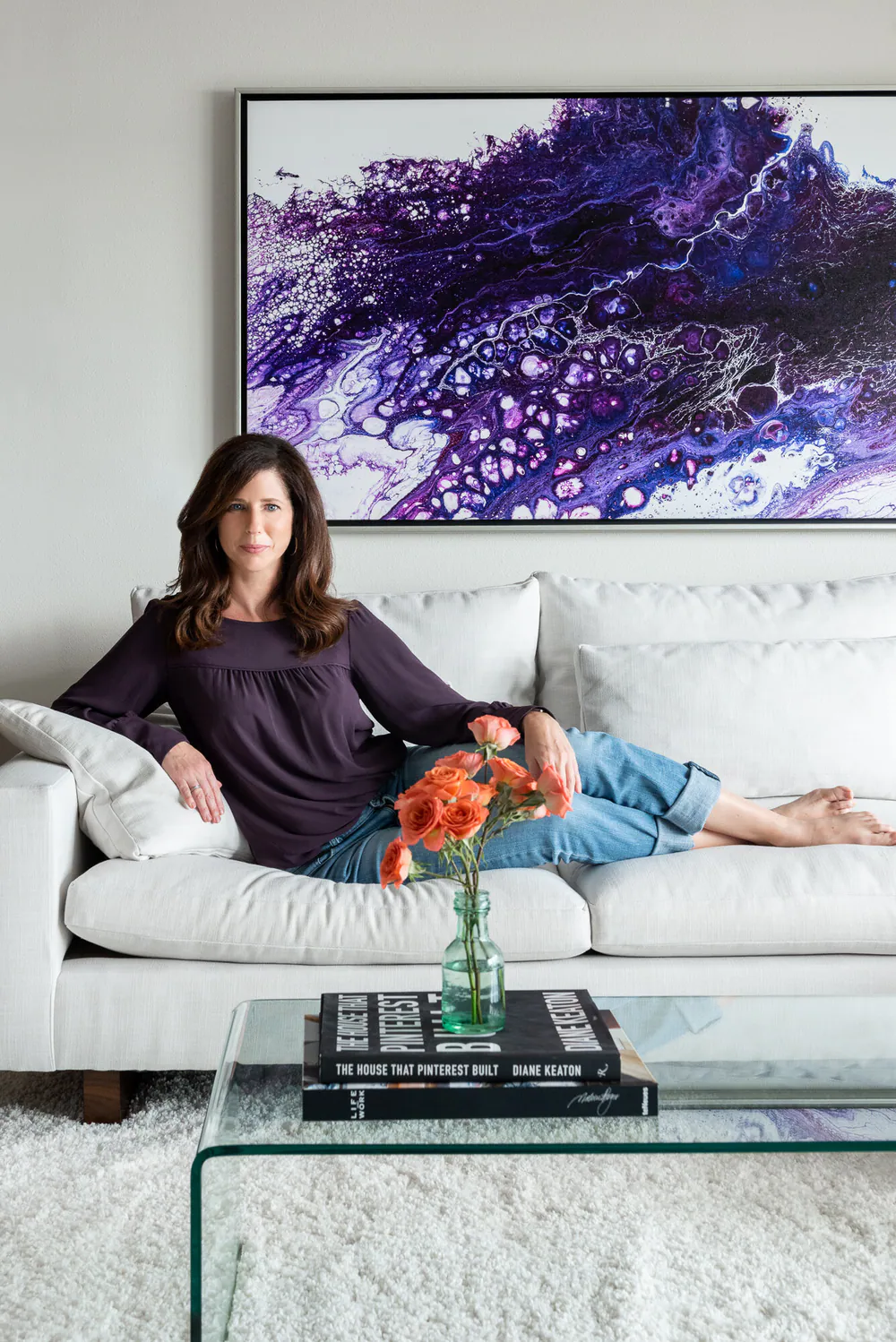 Michelle Jennings, owner and principal interior designer of MJ Designs, in the living room of her Gulf Beaches Condo project